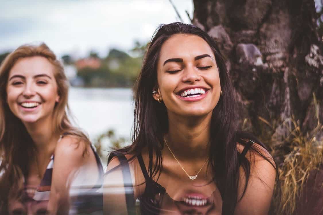 Two Girls Laughing at Something